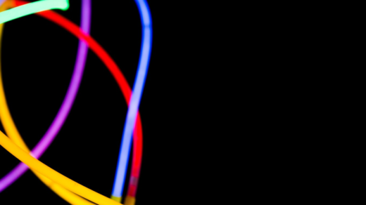 red, blue, purple, and yellow LED lights on a black background