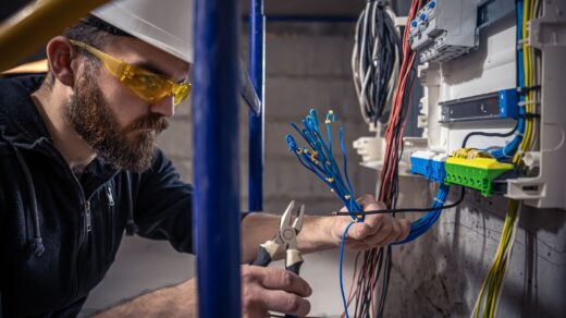 An electrician working with wires