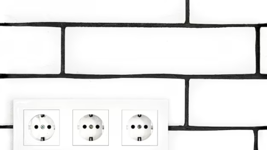 Three white electrical outlets