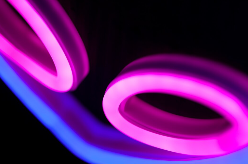 pink circles and blue lights on the ceiling on a black background